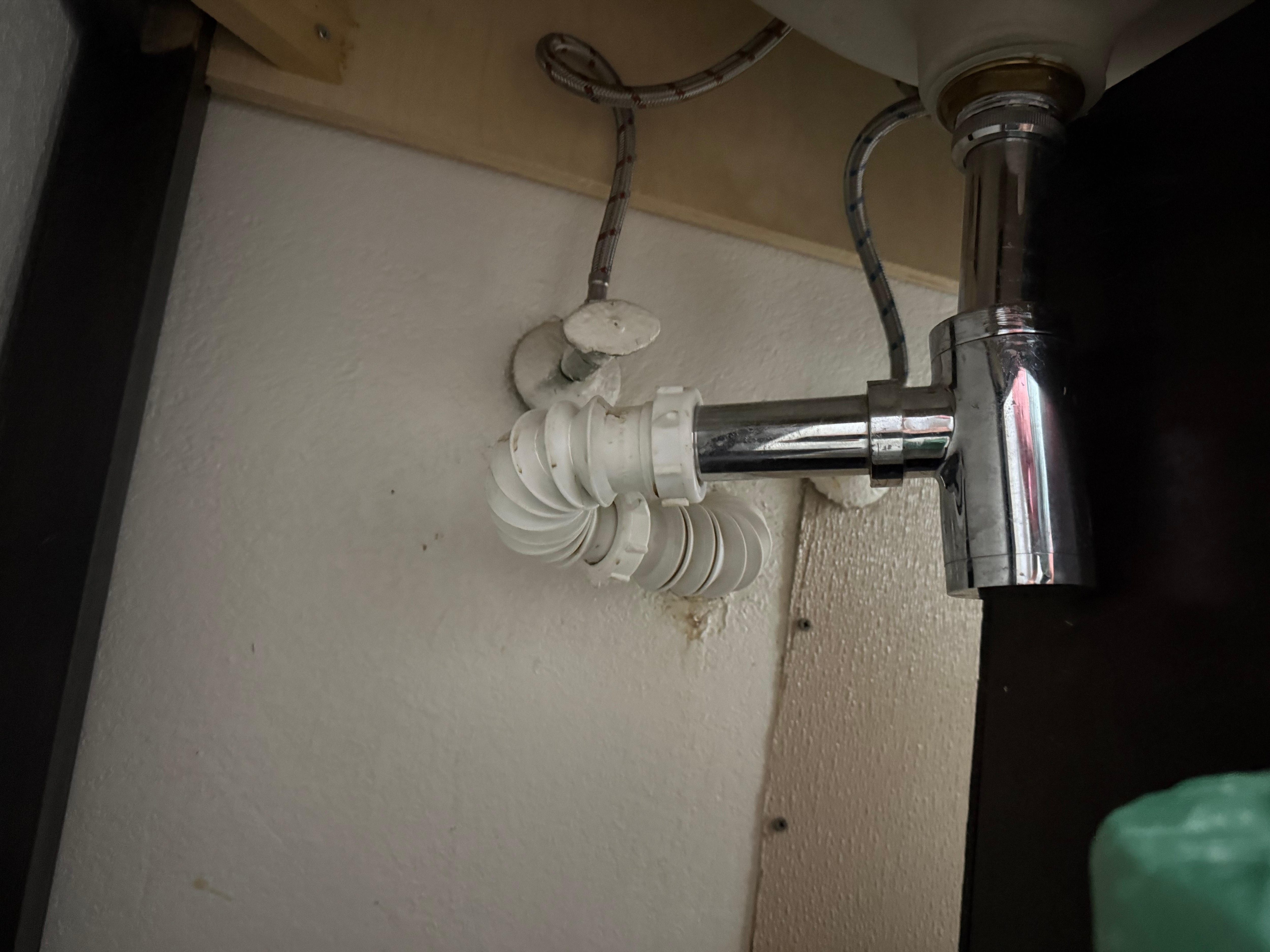 No pee trap installed on the sink means sewer gas backs up through the pipes and into the room.
