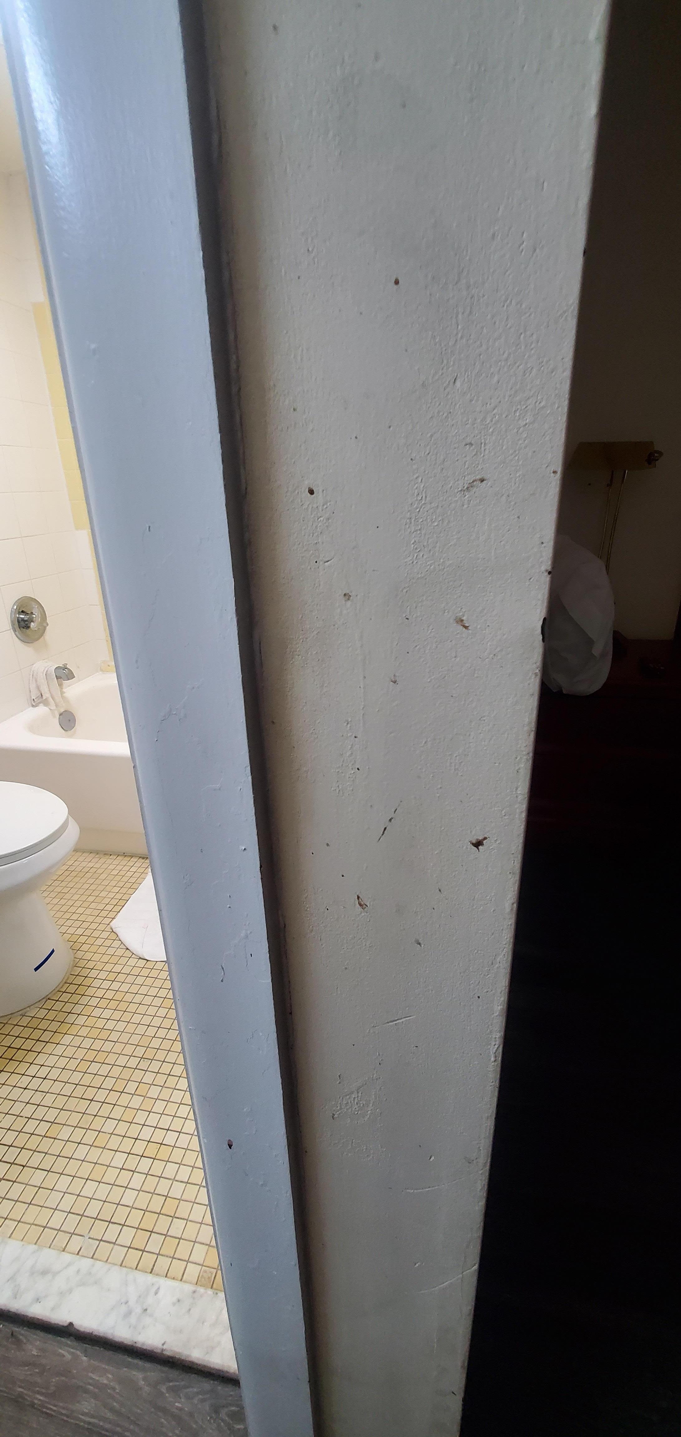 Missing rack? Apparently hand iron at one time? Patches on wall.