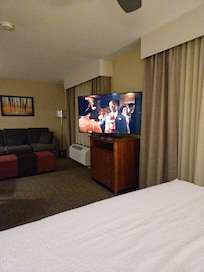 TV is on a swivel, so you can face it towards the bed.