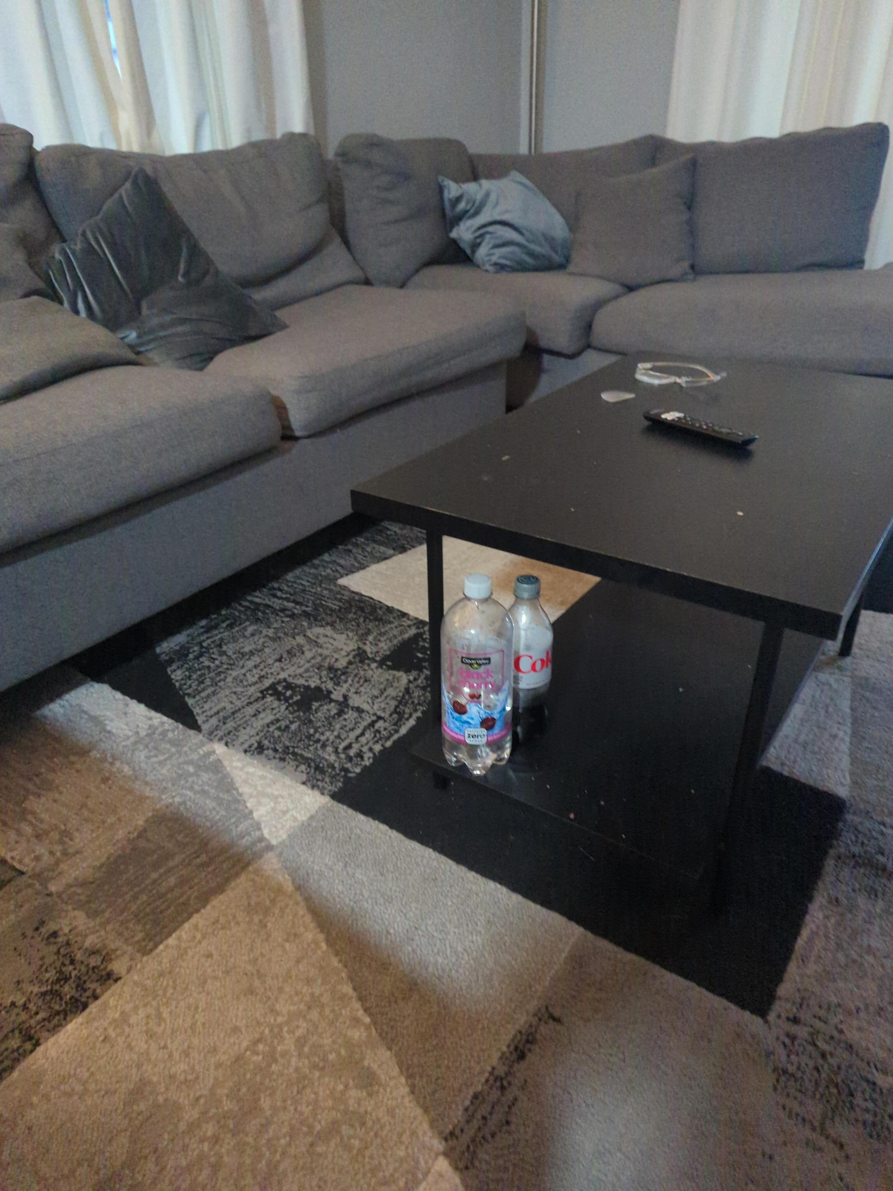 Soda bottles left. Couch was a mess