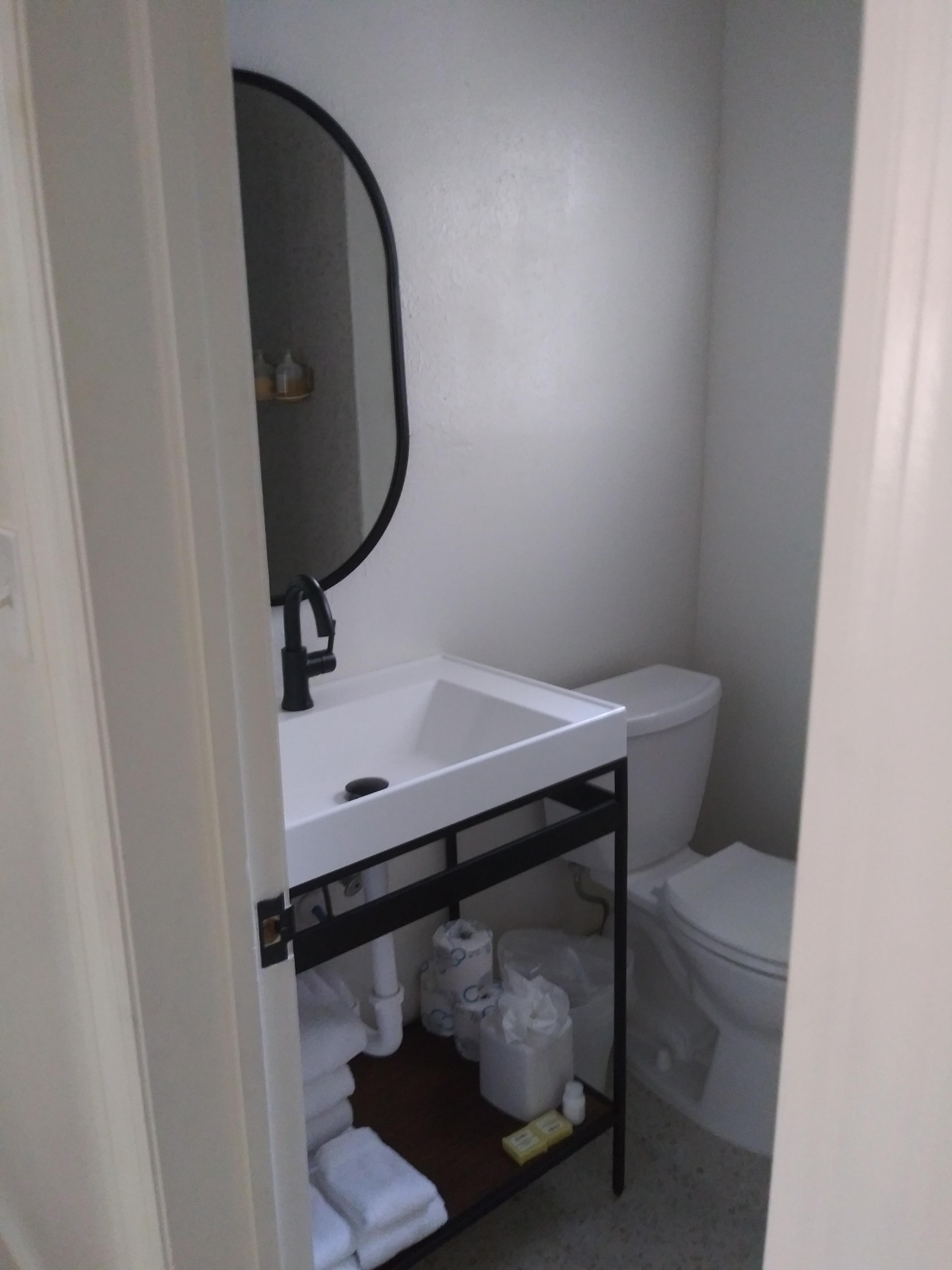Bathroom with the usuals provided (towels, shampoo, conditioner, body wash, lotion, hand soap)