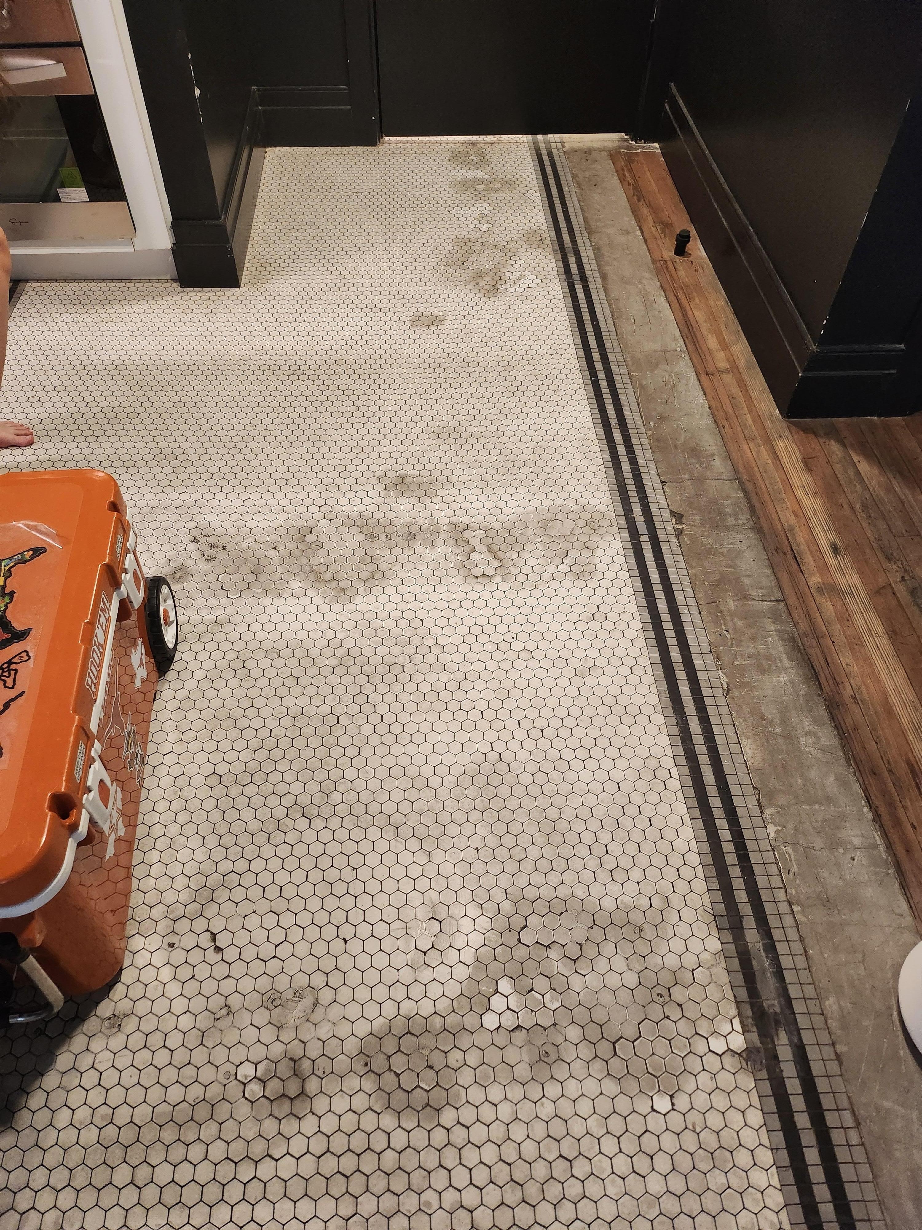 The flooring is severely stained and badly in of repairs.