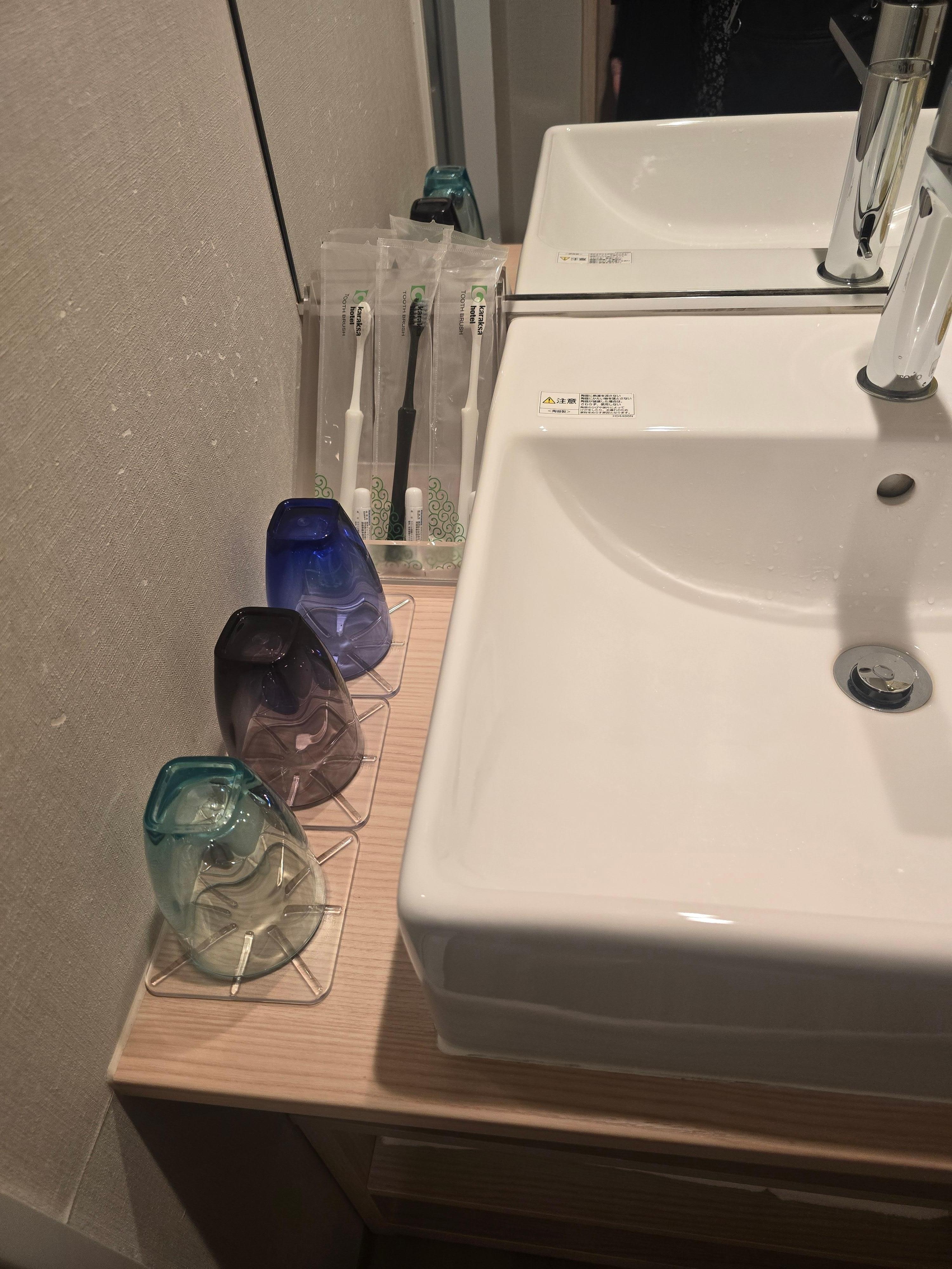 One of two sinks, separate from the toilet and shower.