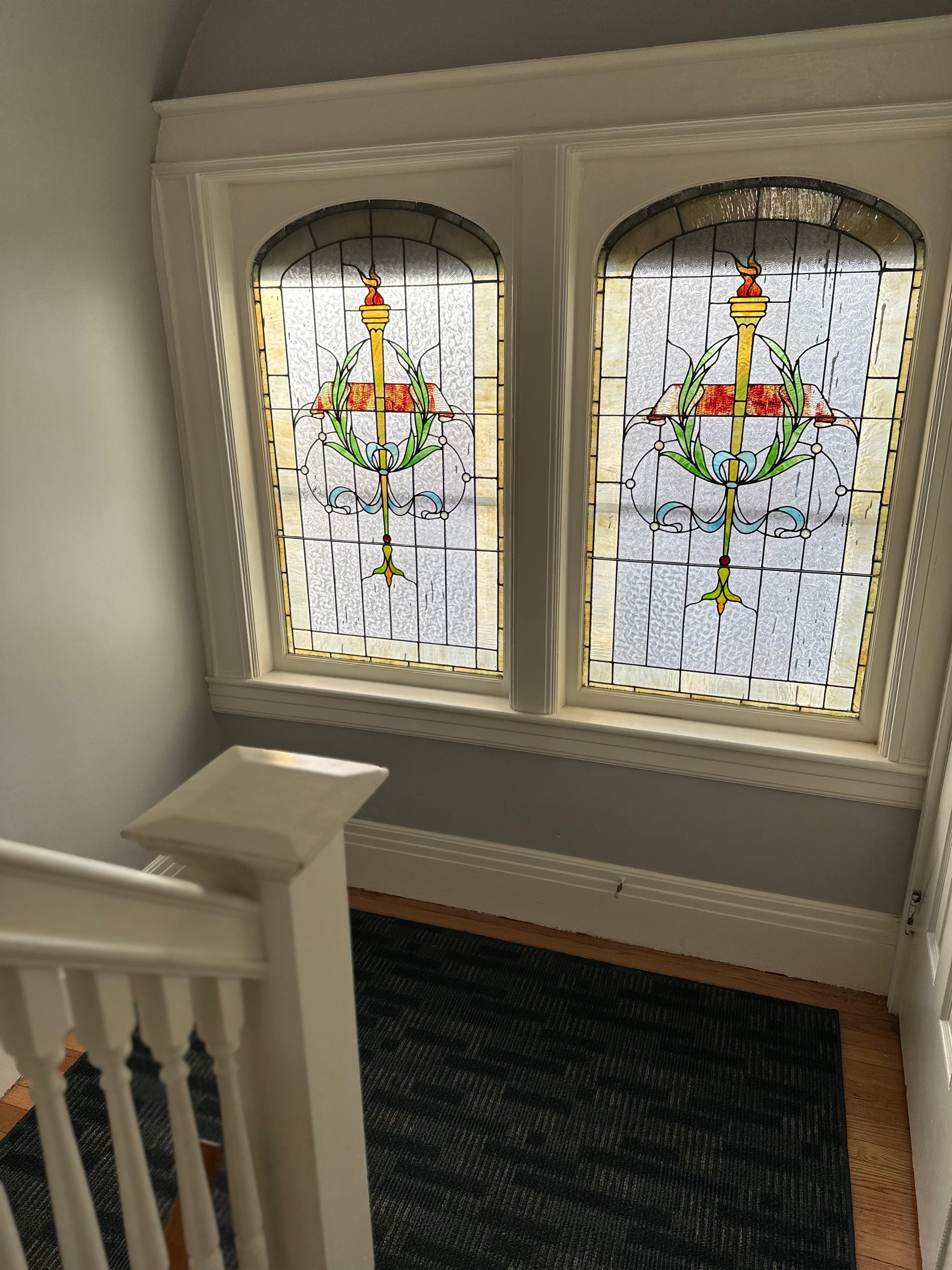 Beautiful stained glass going up the stairs to the apartment. 