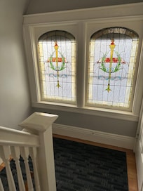 Beautiful stained glass going up the stairs to the apartment.