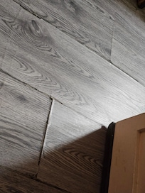 Floors peeling and spongy due to water damage in subfloor