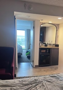 This is the room looking from the door you walk in. The hide a bed is out. There is also a table in the front room.