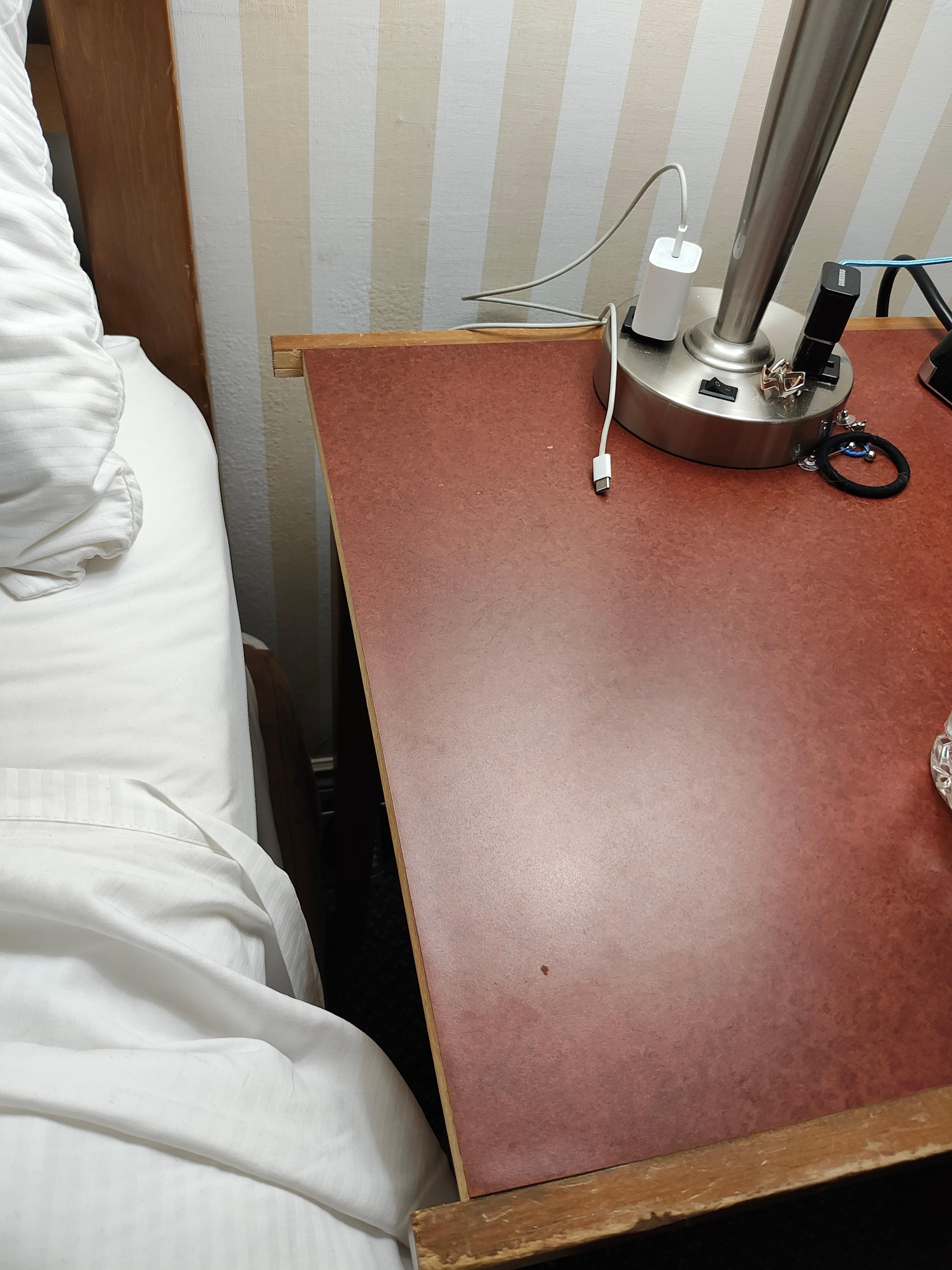 Broken nightstand. This was the general look and feel of the room. Old furniture and decor can have it's charm. Not so much when broken.