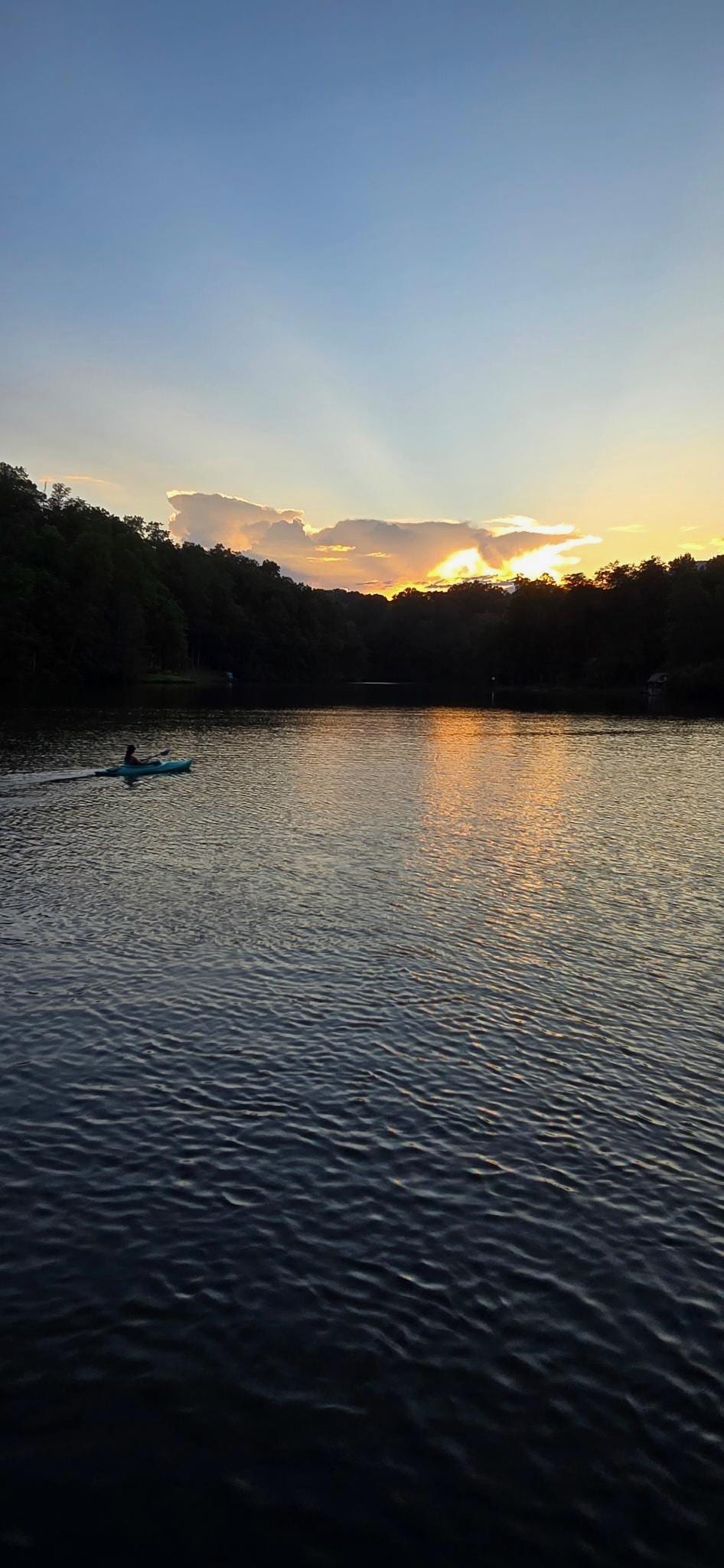 enjoying the canoe on the lake during sunset