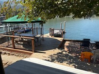 Private dock, patio and deck right on the water.