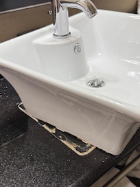 Wet caulk preventing sink from remaining stationary