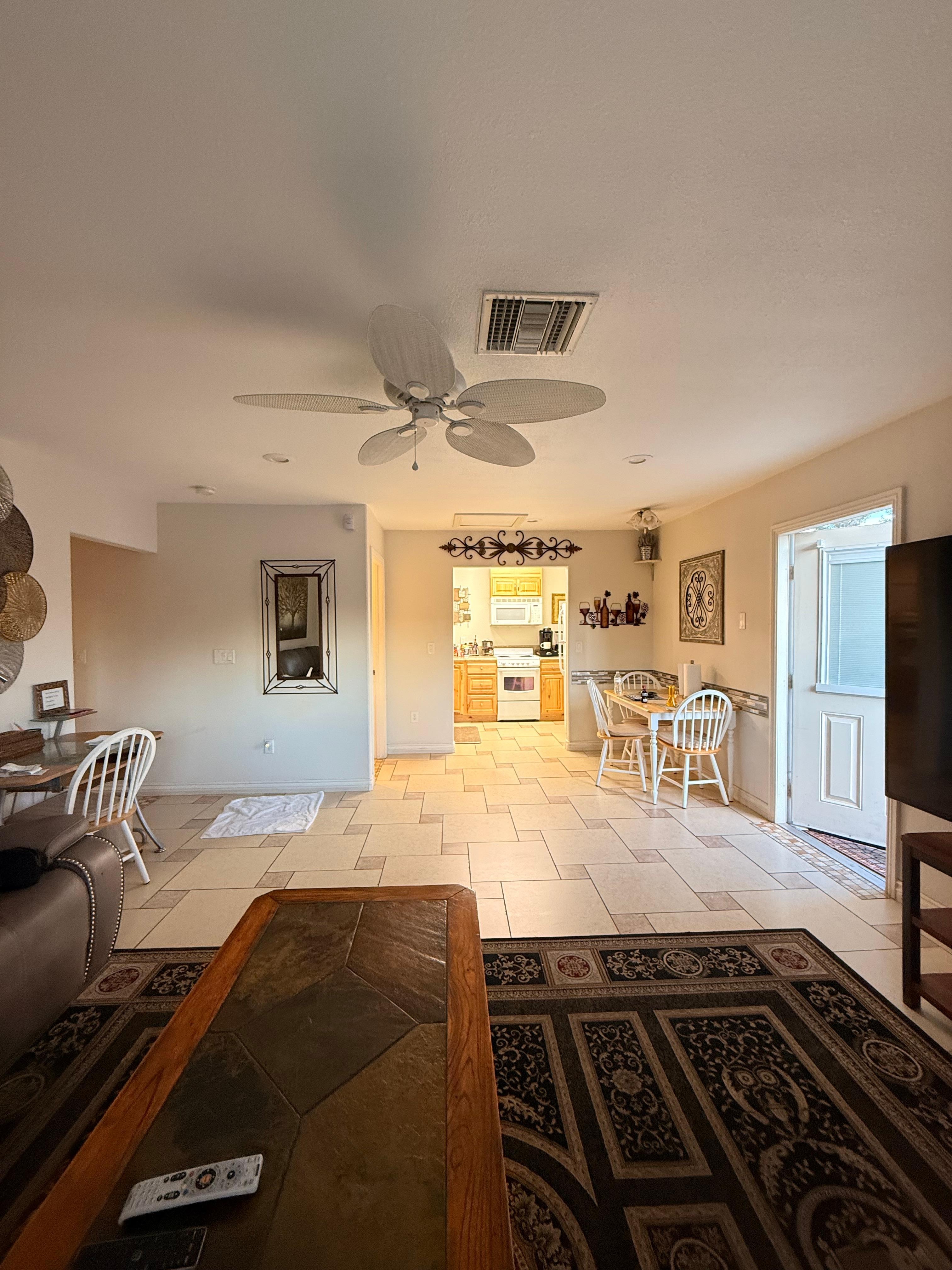 Beautiful living room with recliner couches and coffee table - 