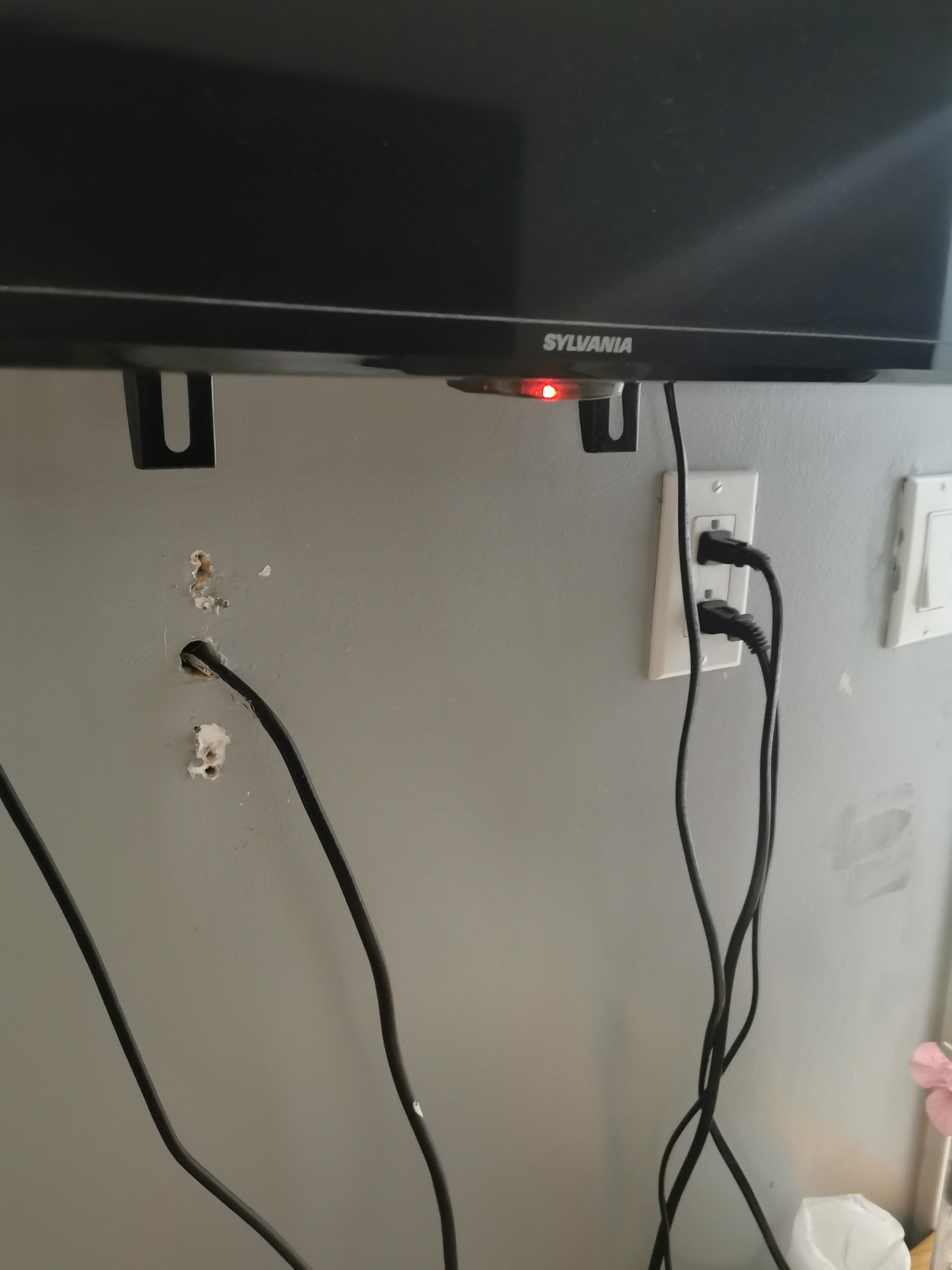 Just holes in the wall under the tv