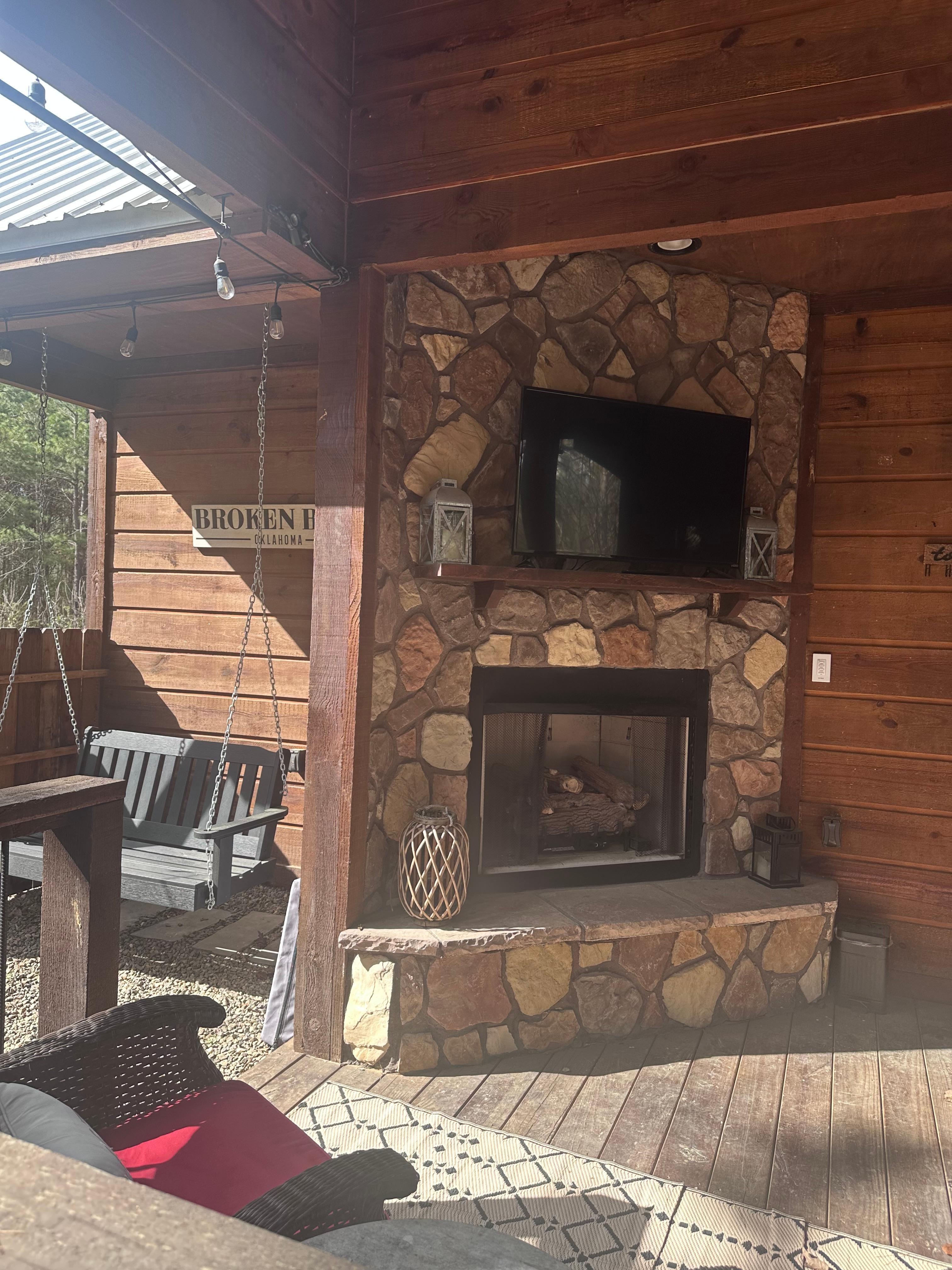 Another picture of outside fireplace, showing the swing