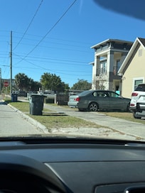 Garbage cans in the only way in to park at the entrance to my rental