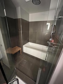 Large shower/bath area in room