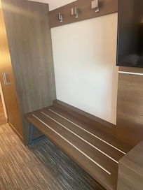 Nice bench to put bags and hang clothes