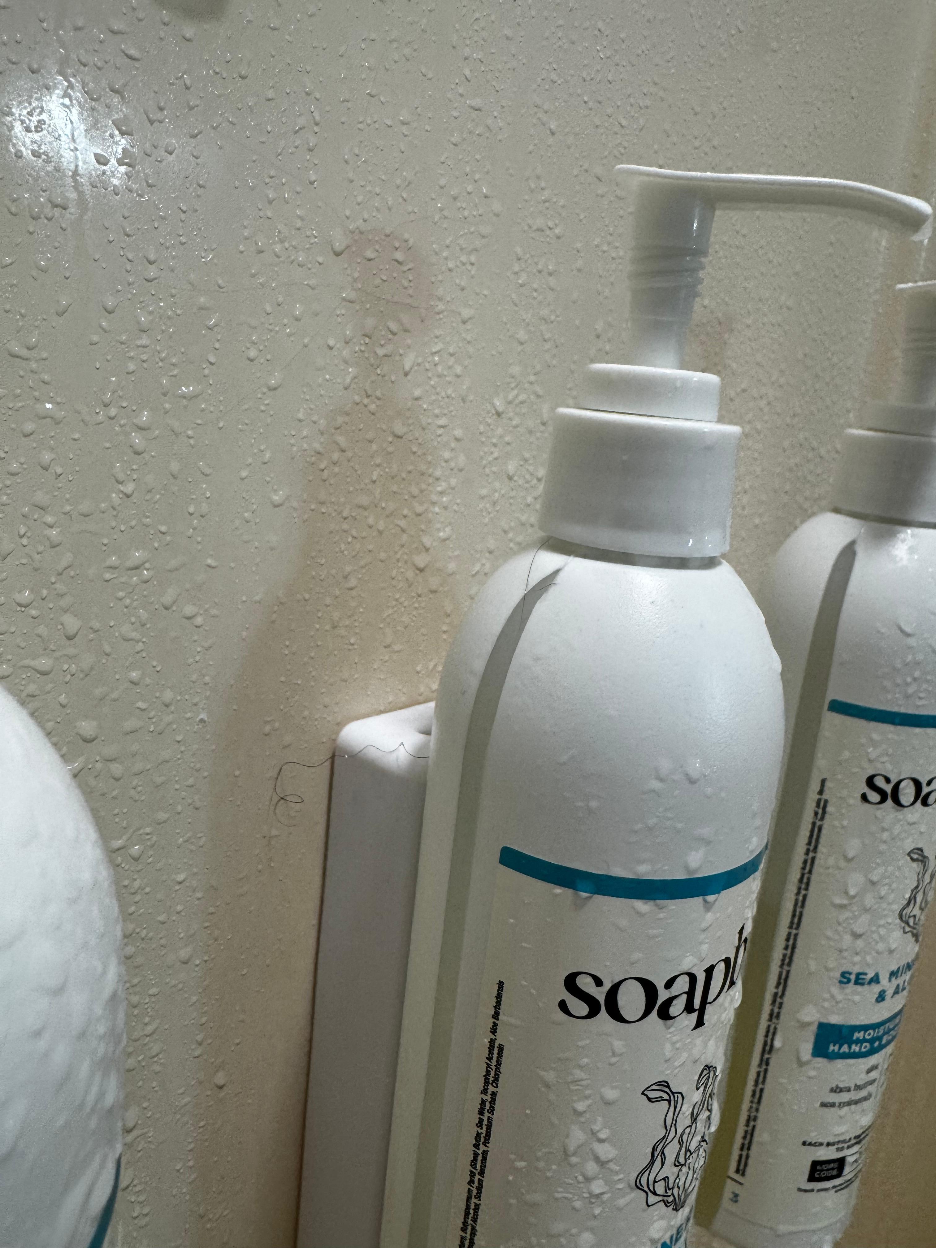 Hair near the shampoo bottles