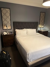 King-size bed, two nightstands, digital alarm clock