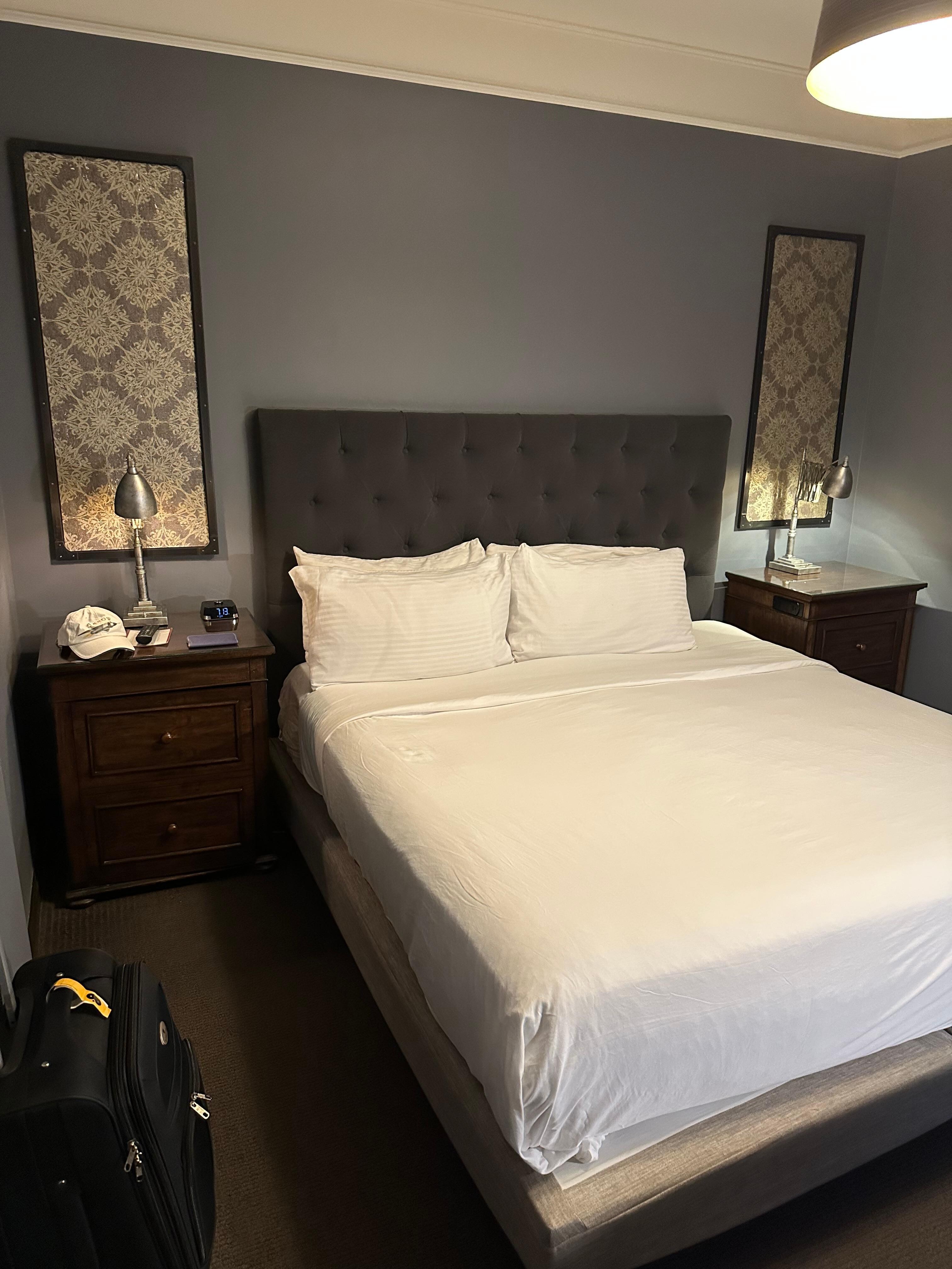 King-size bed, two nightstands, digital alarm clock