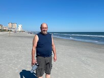 My husband on a warm sunny day on the scantily populated beach. It was so incredibly nice!