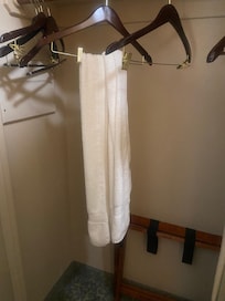 Dirty towel from a previous customer hanging in the closet.