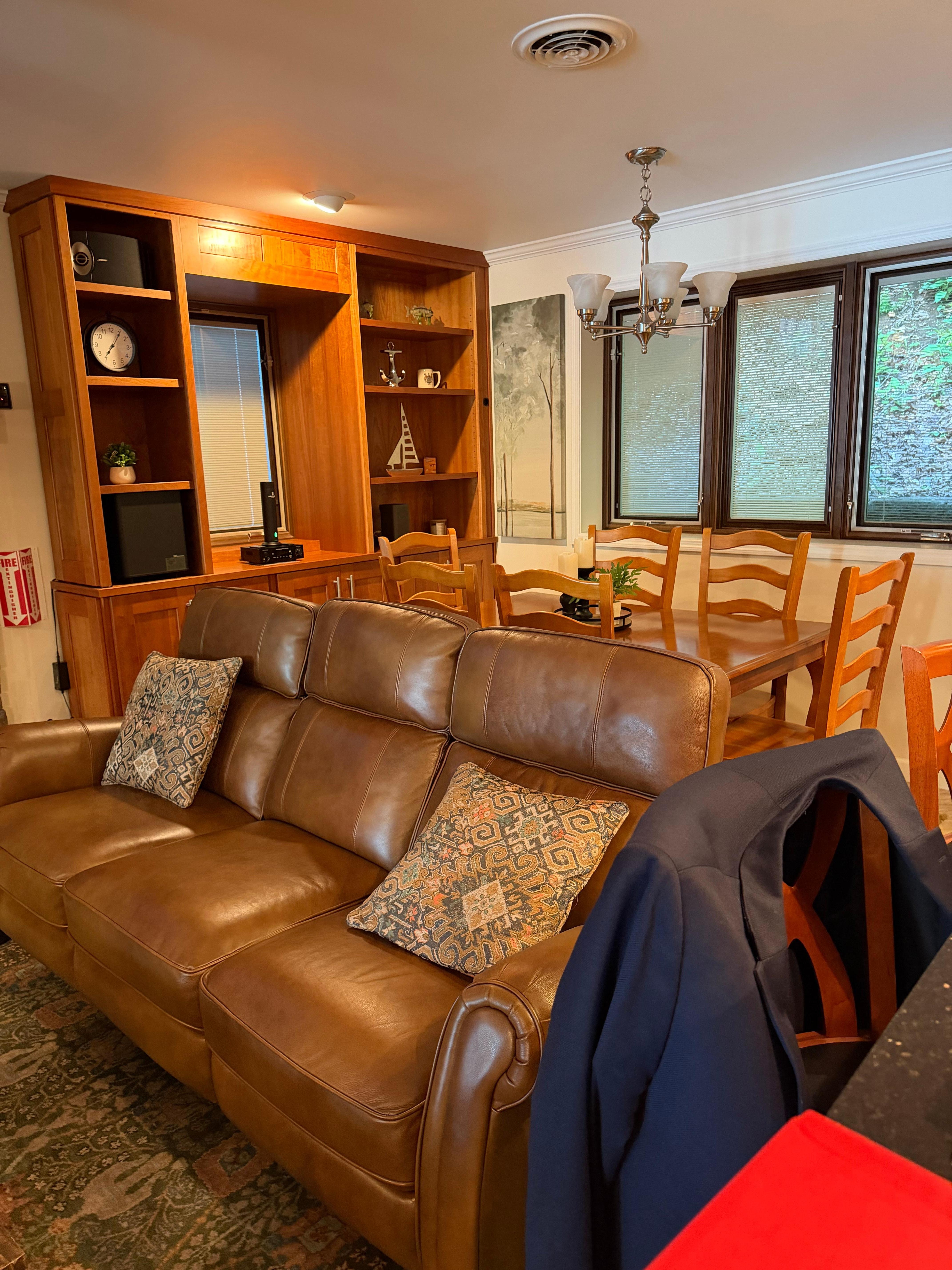 Beautiful living room area and dining room for sit down gatherings 