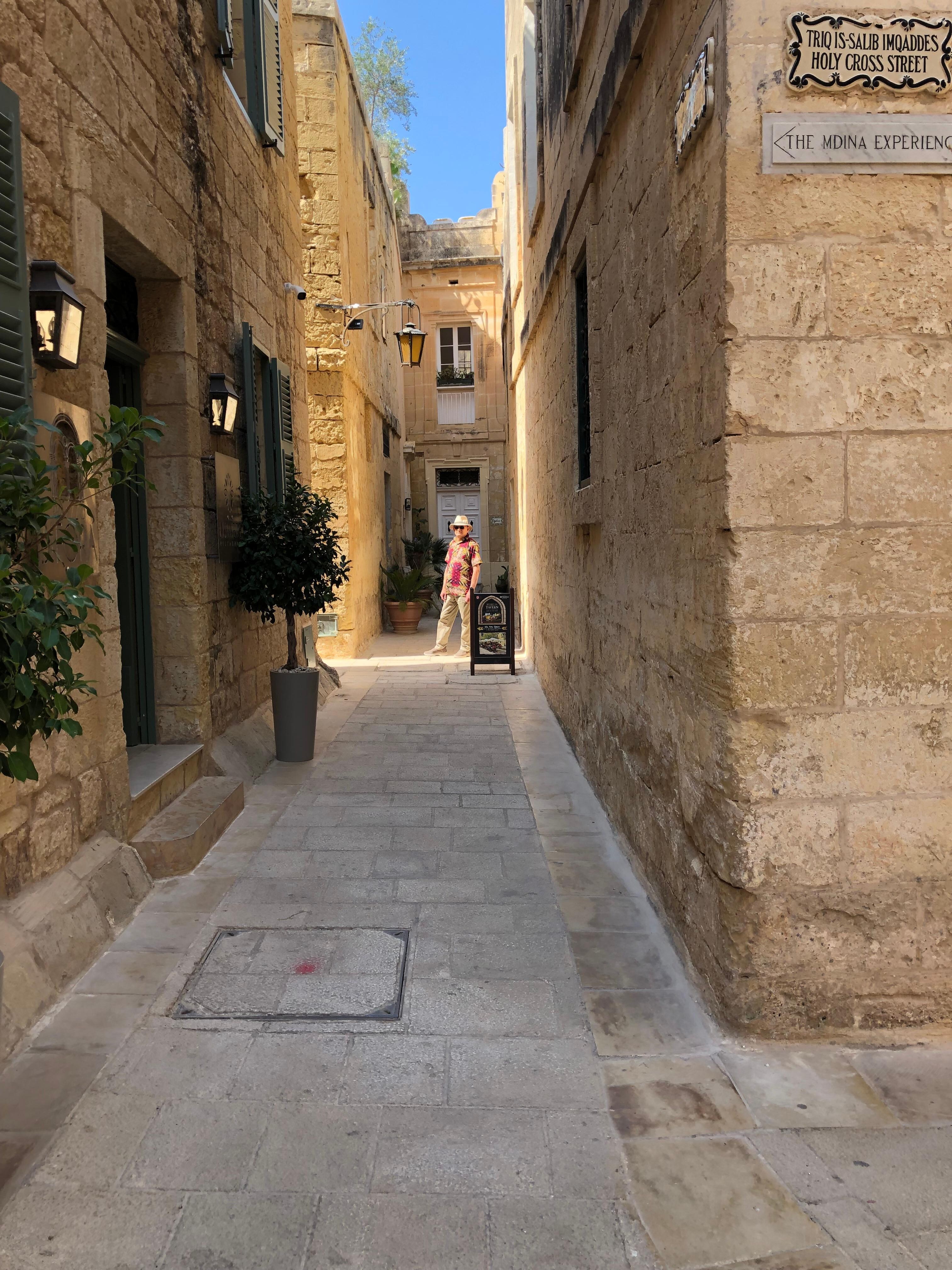 The lane with the door to the house at the end