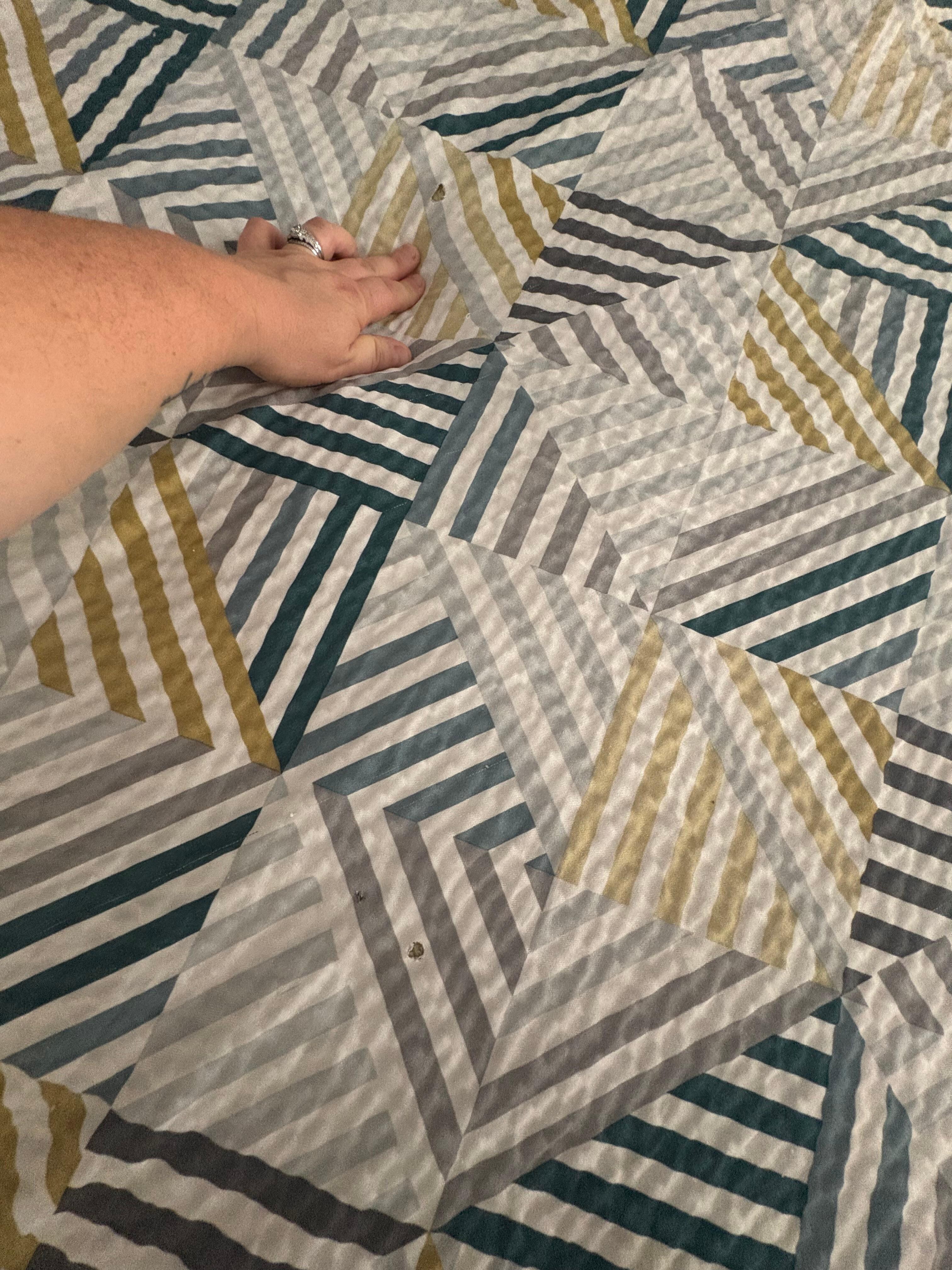 Cigarette burns in the bedding