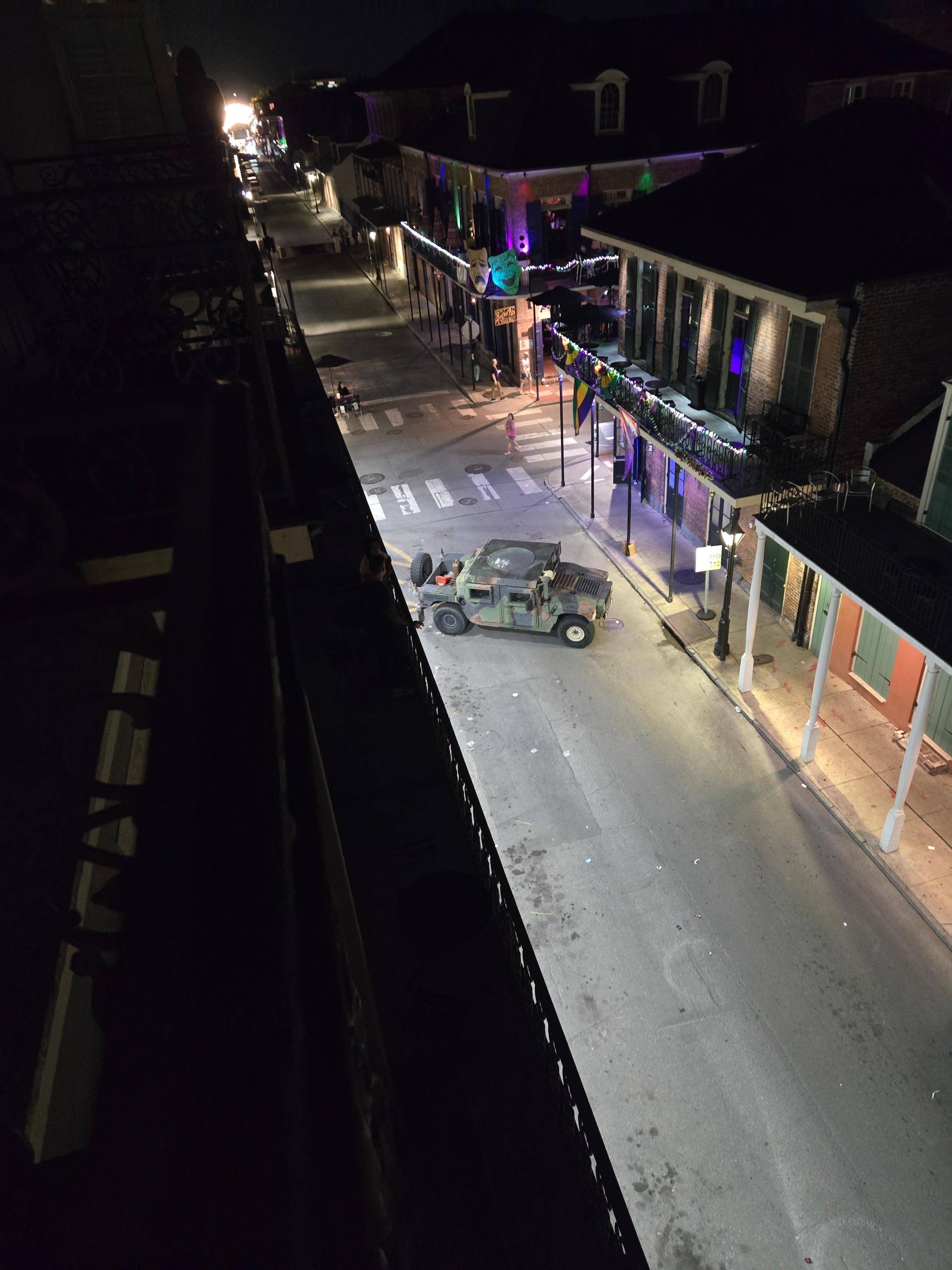 Night view from balcony, intersection at Bourbon st