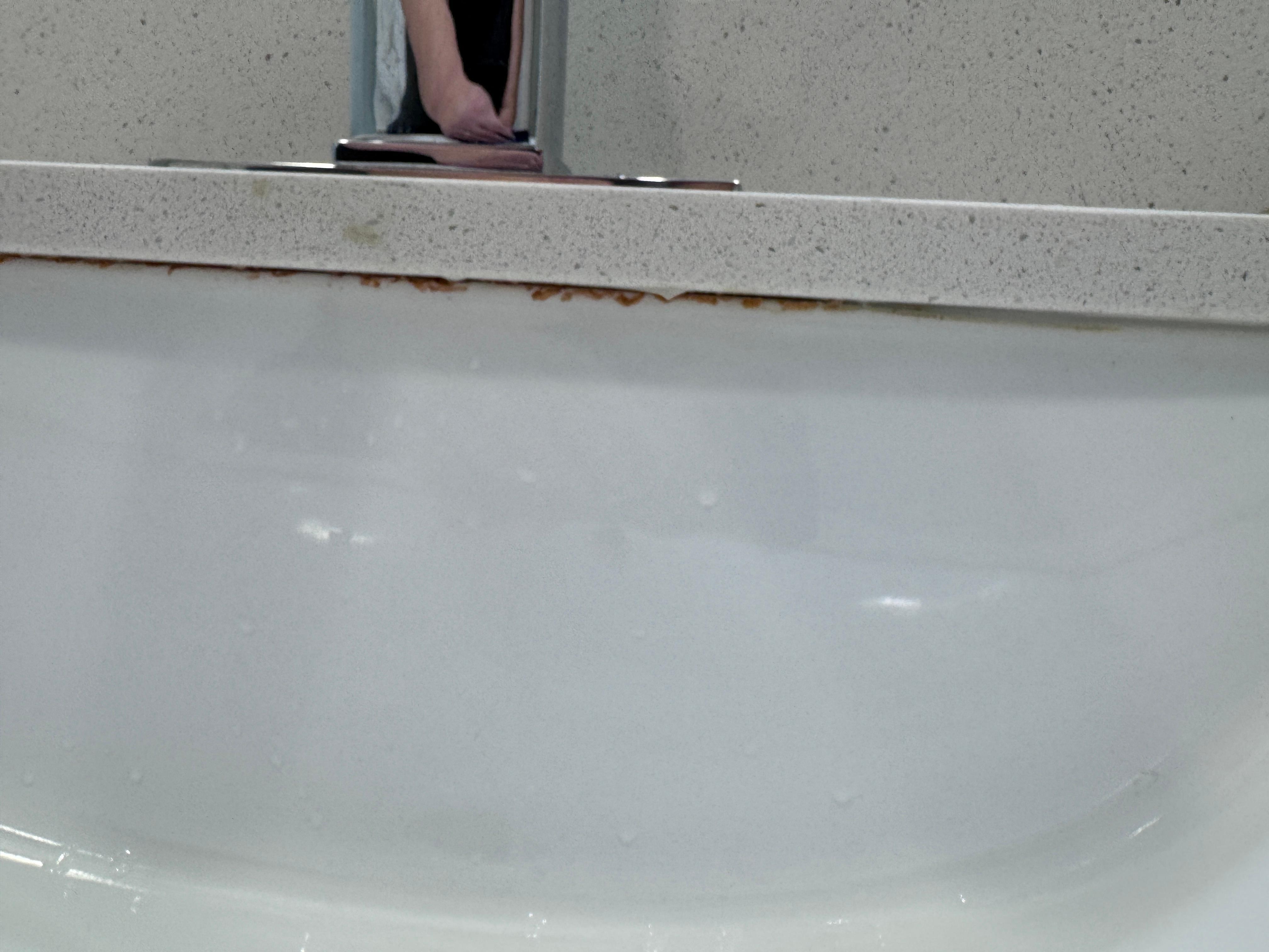 Sludge in edge of sink 