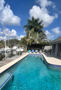 View of the pool and tiki bar.
