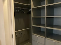 Wonderful large closet with two sets of drawers and hanging areas