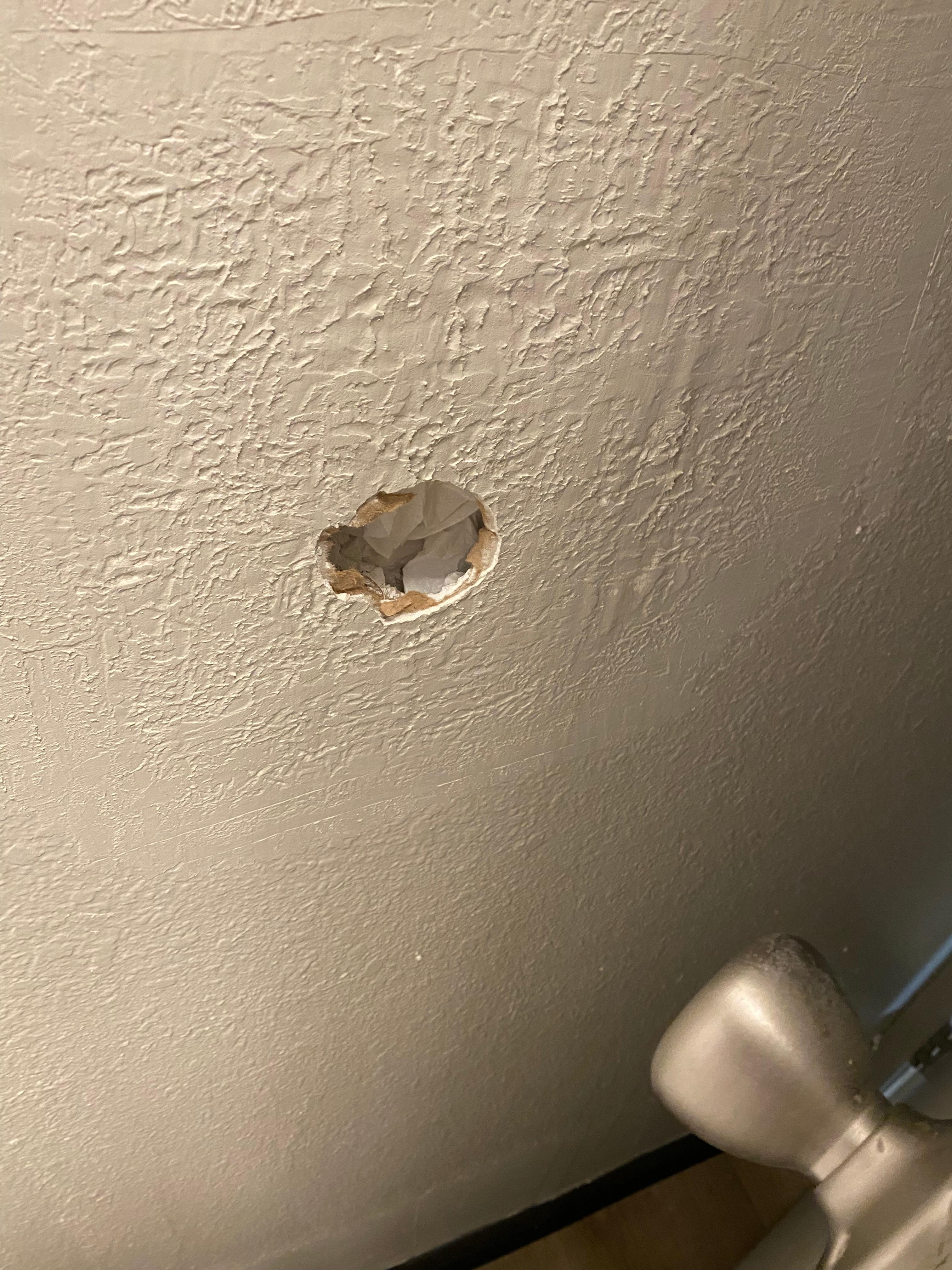 Behind the bathroom door