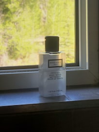 Half used bottle of body wash.