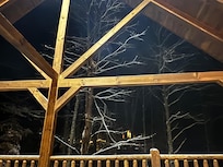 Nice covered wrap-around deck with plenty of outdoor seating.