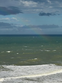 The rainbow rises from the sea... so poetic!