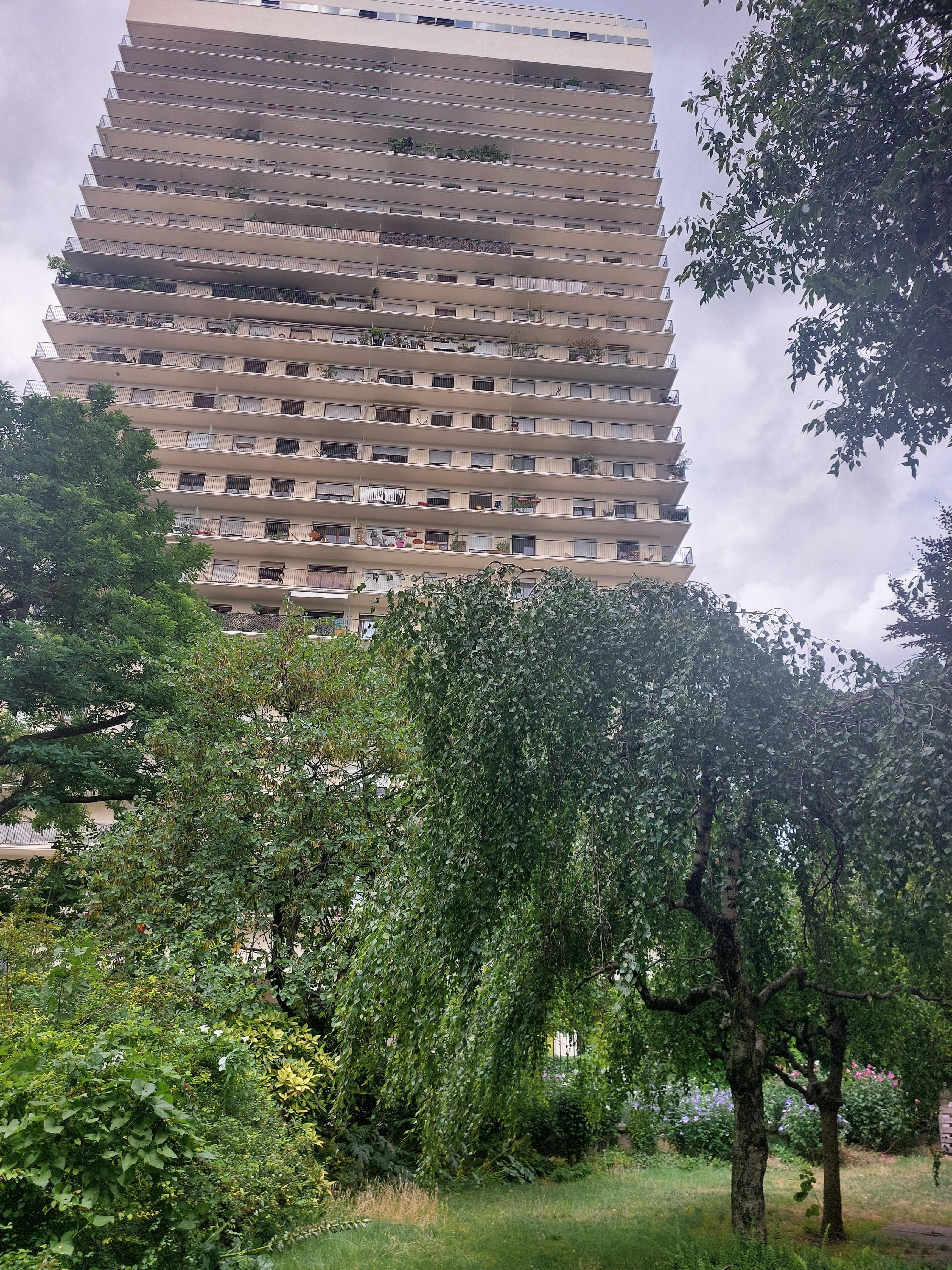 View of the apartment building, taken from a beautiful park behind the complex.
