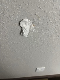 Hole in wall stuck with tissue