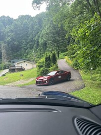 First driveway only in and out for the red car.