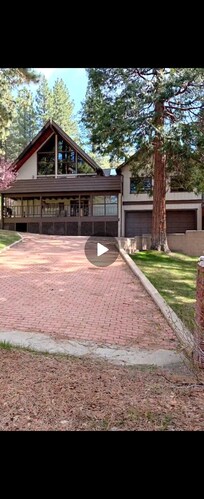 Hidden backyard driveway and 2 car garage located underain garage