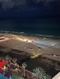 Police on the beach that night (from the balcony of the room).