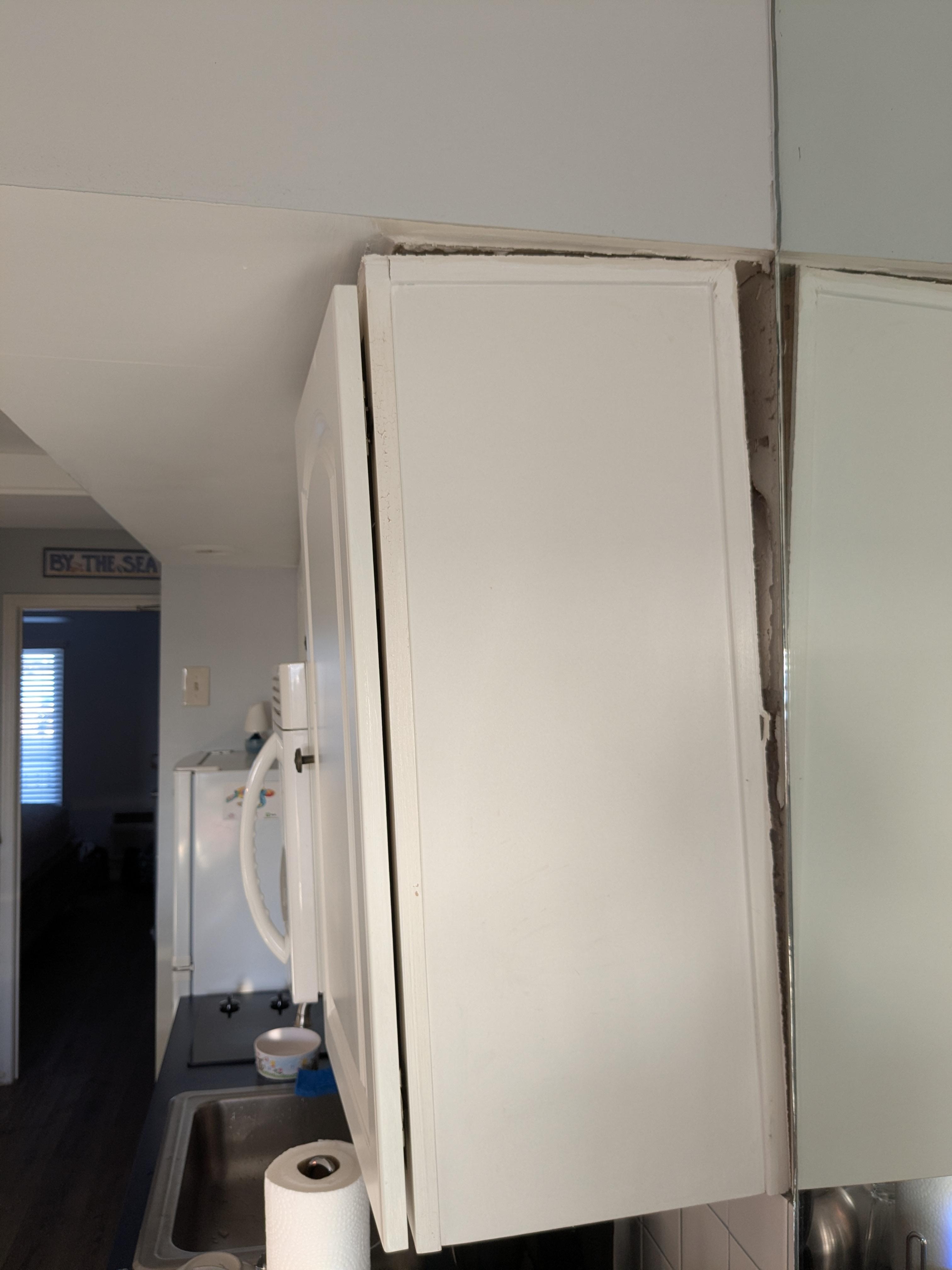 Cabinet falling off wall
