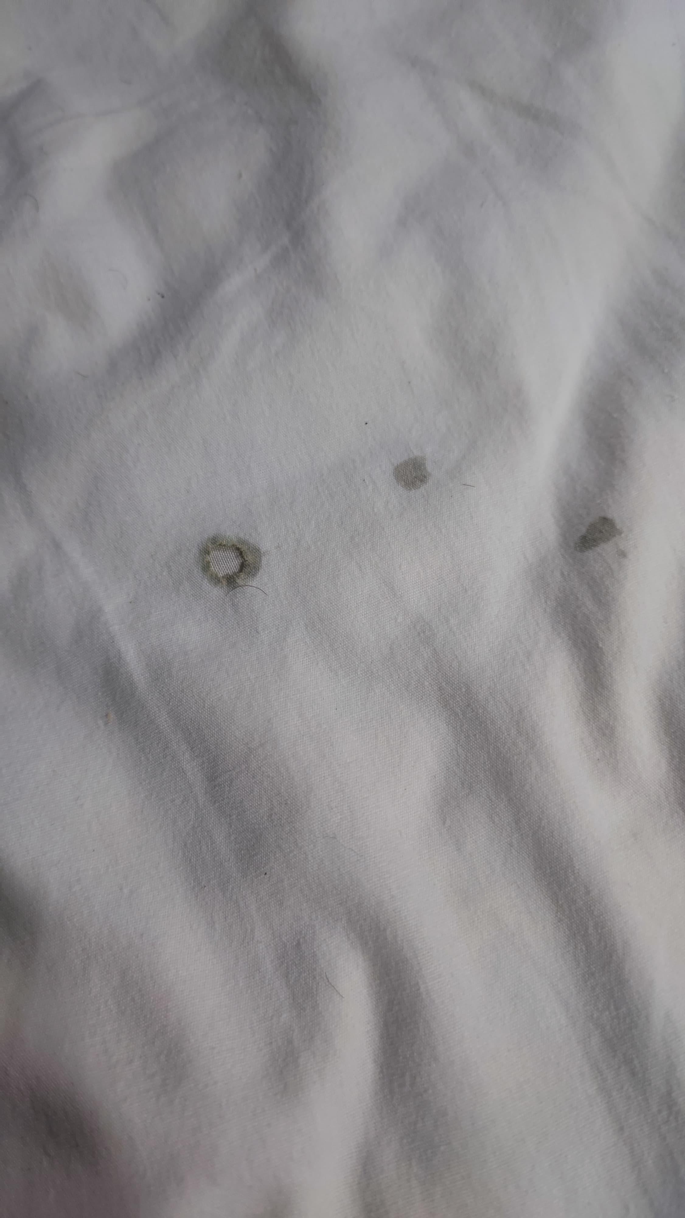 burnt cigarette spots on sheets