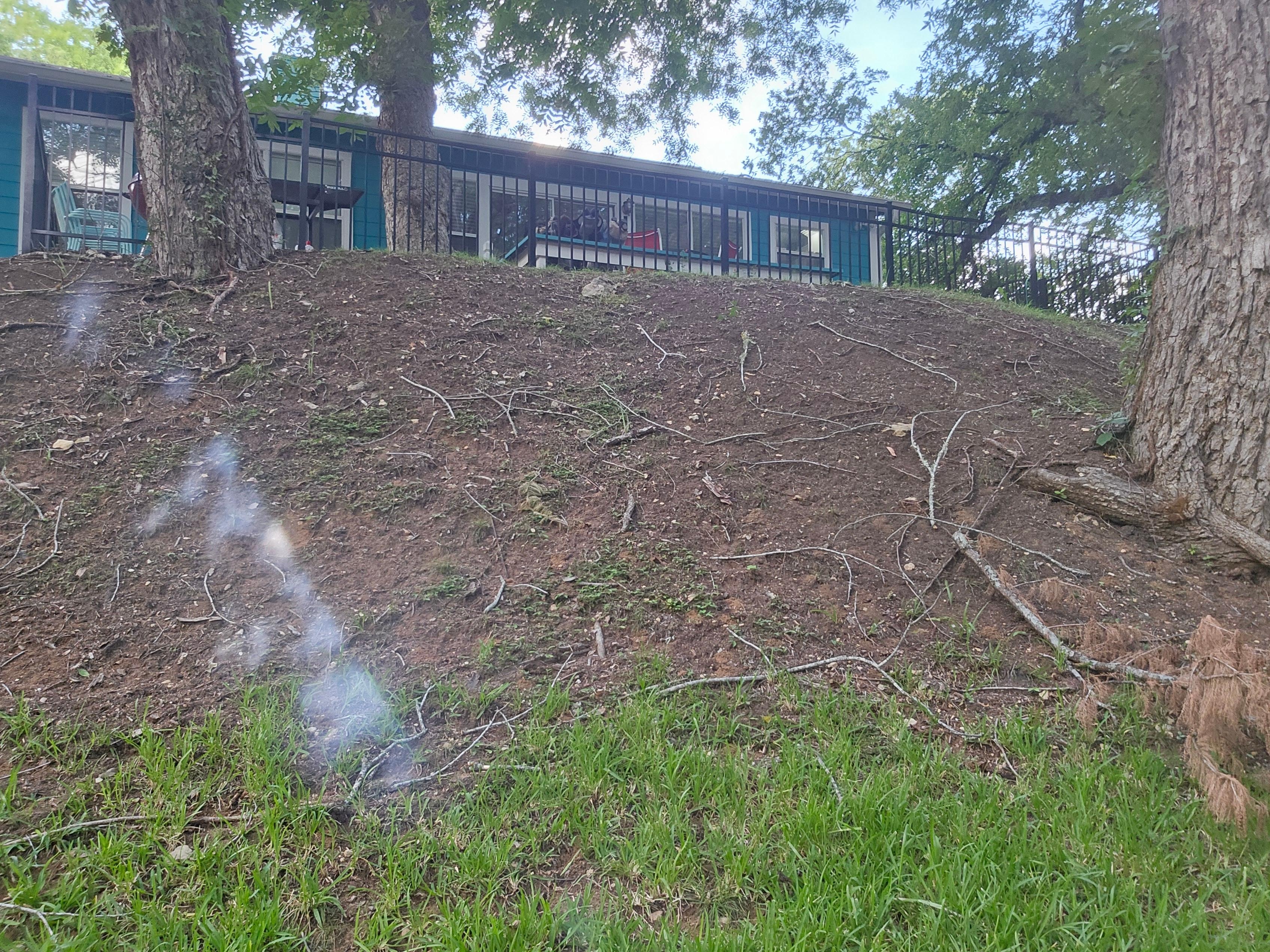 At water looking up at house