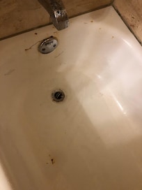 Rust is shower with clogged drain