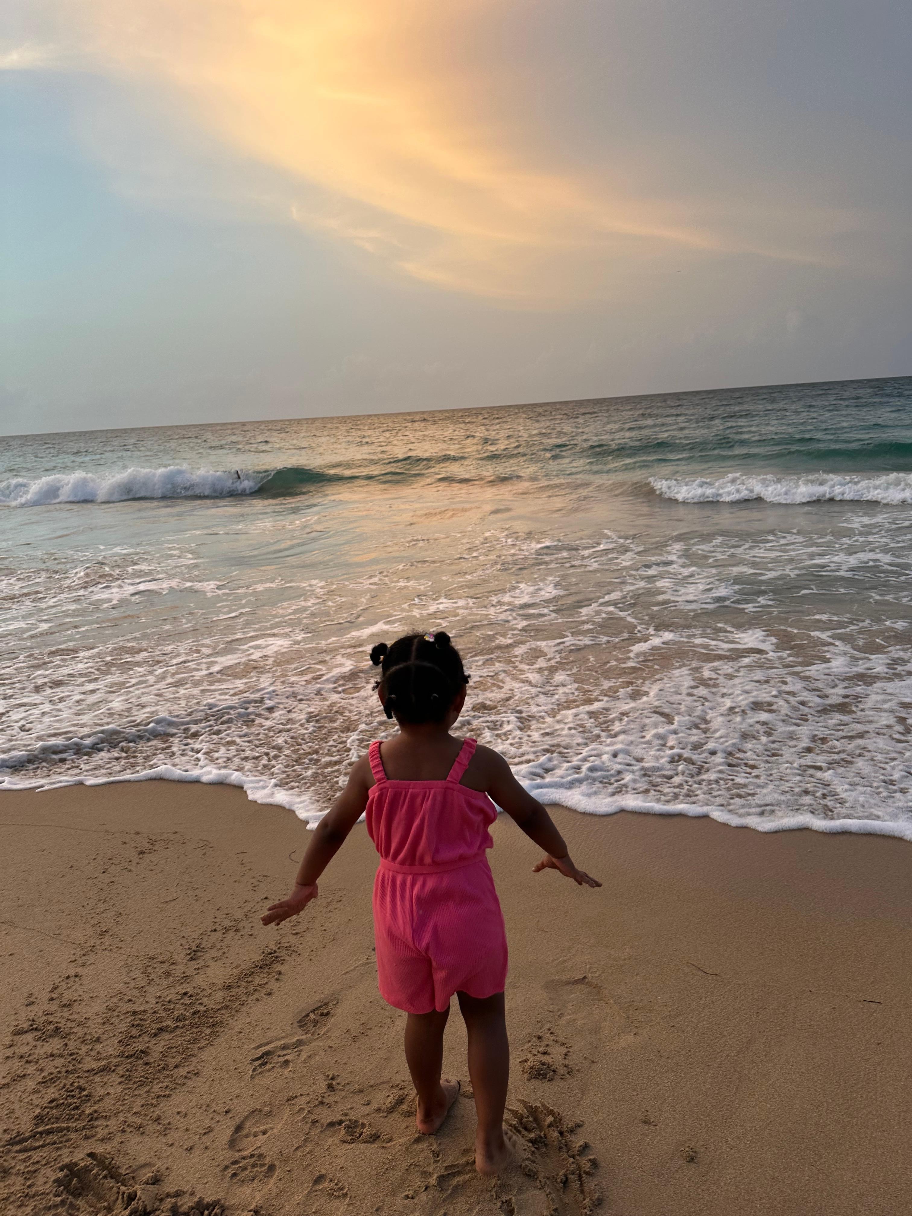 Daughter enjoying the sand in her toes.