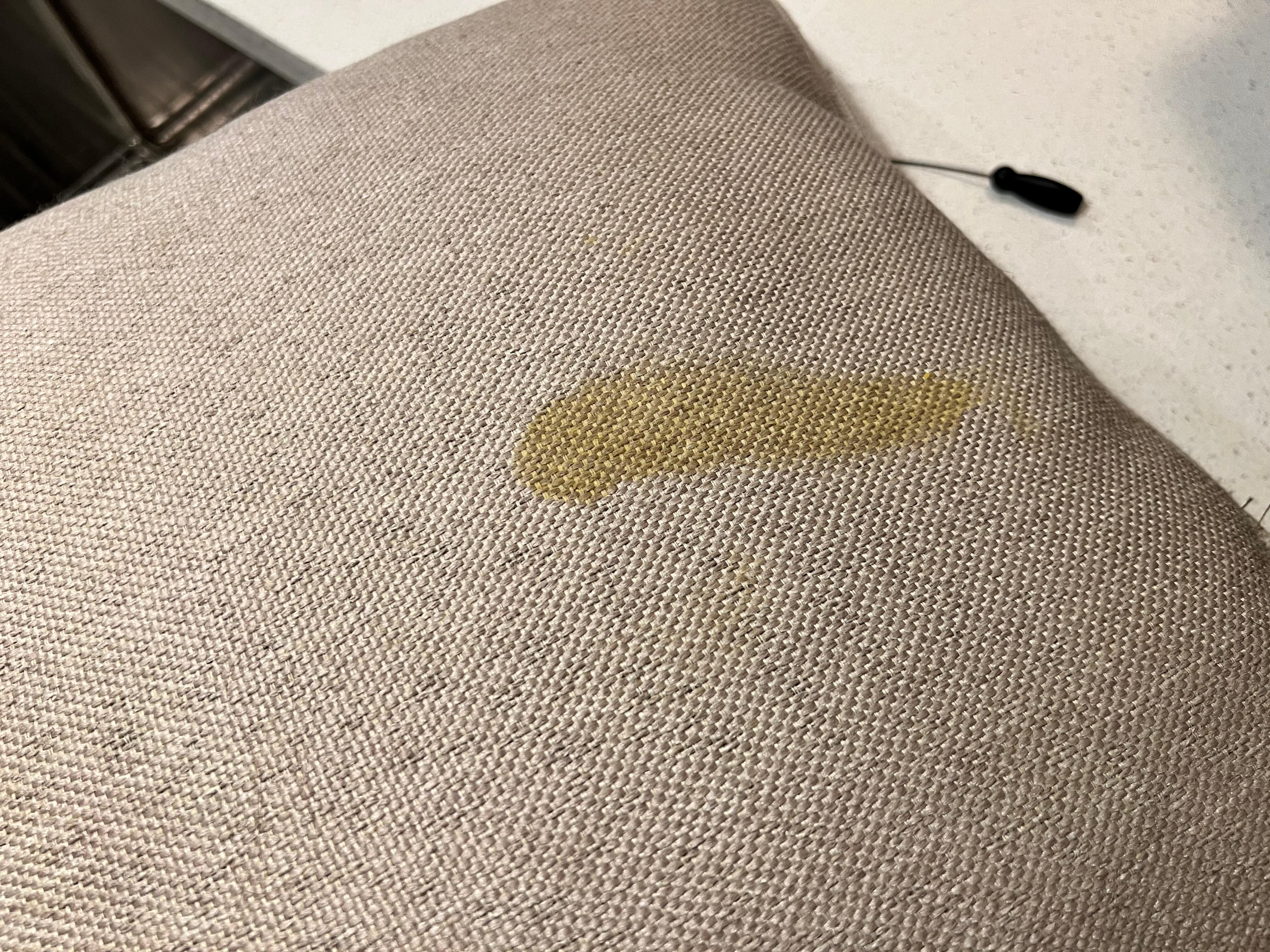 Unknown stain on throw pillow