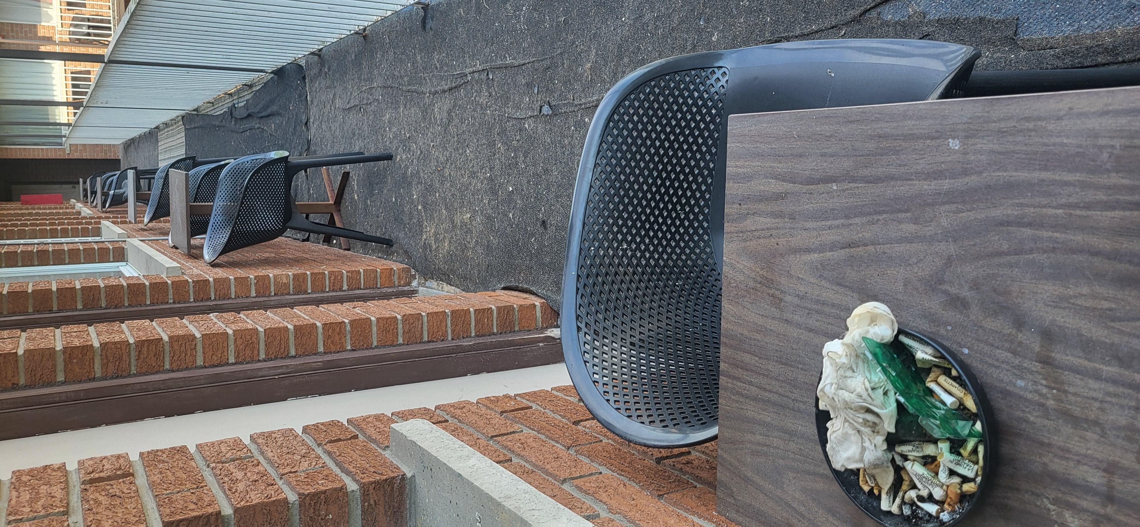 Ashtrays and torn carpet on 2nd story