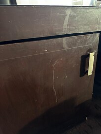 Cabinet door where the refrigerator is located. 2nd room